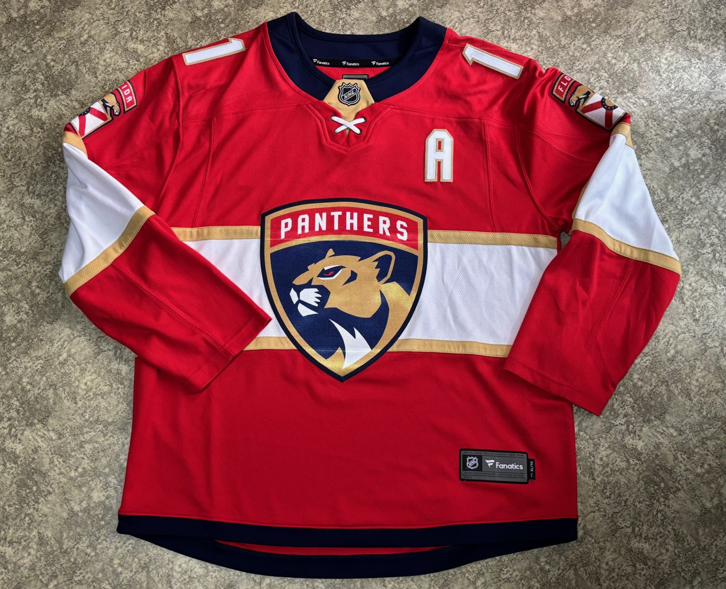 Fandres Huberdeau z Floridy Panthers s podpisem fotka